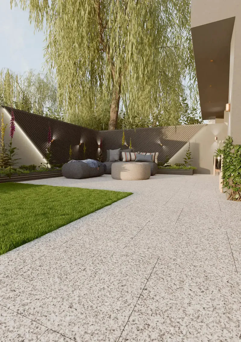 A finished garden patio with outdoor seating and planting