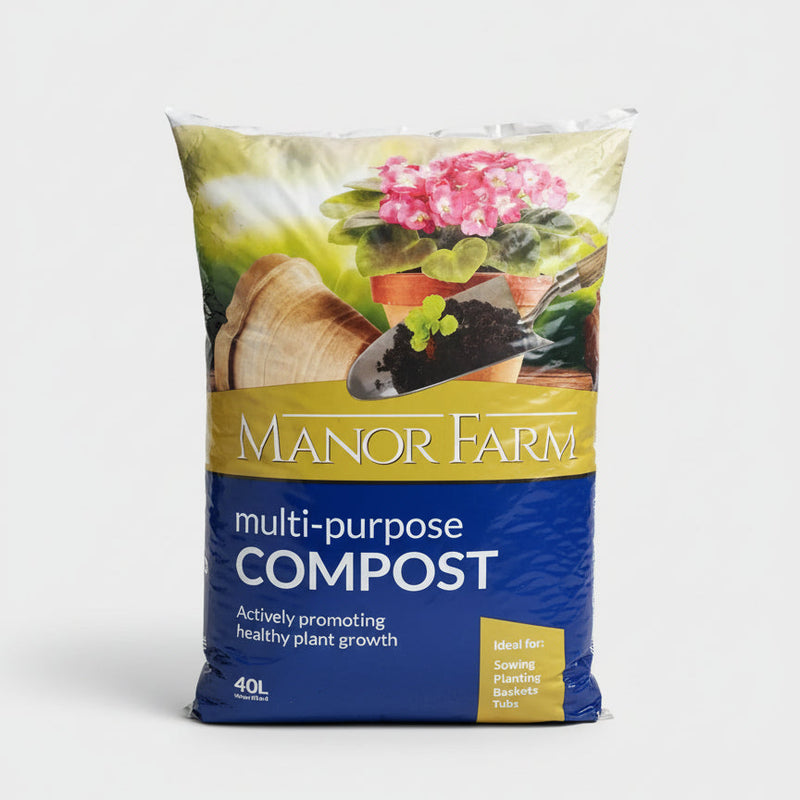 Bag of Manor Farm multi-purpose compost with gardening imagery on a concrete surface.
